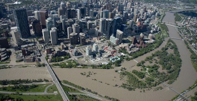 A flooded downtown Calgary is seen from a aerial view of the city Saturday, June 22, 2013. The Conservative government has tabled their spending estimates, budgeting $690 million for disaster funding, much of which will go towards flood recovery.